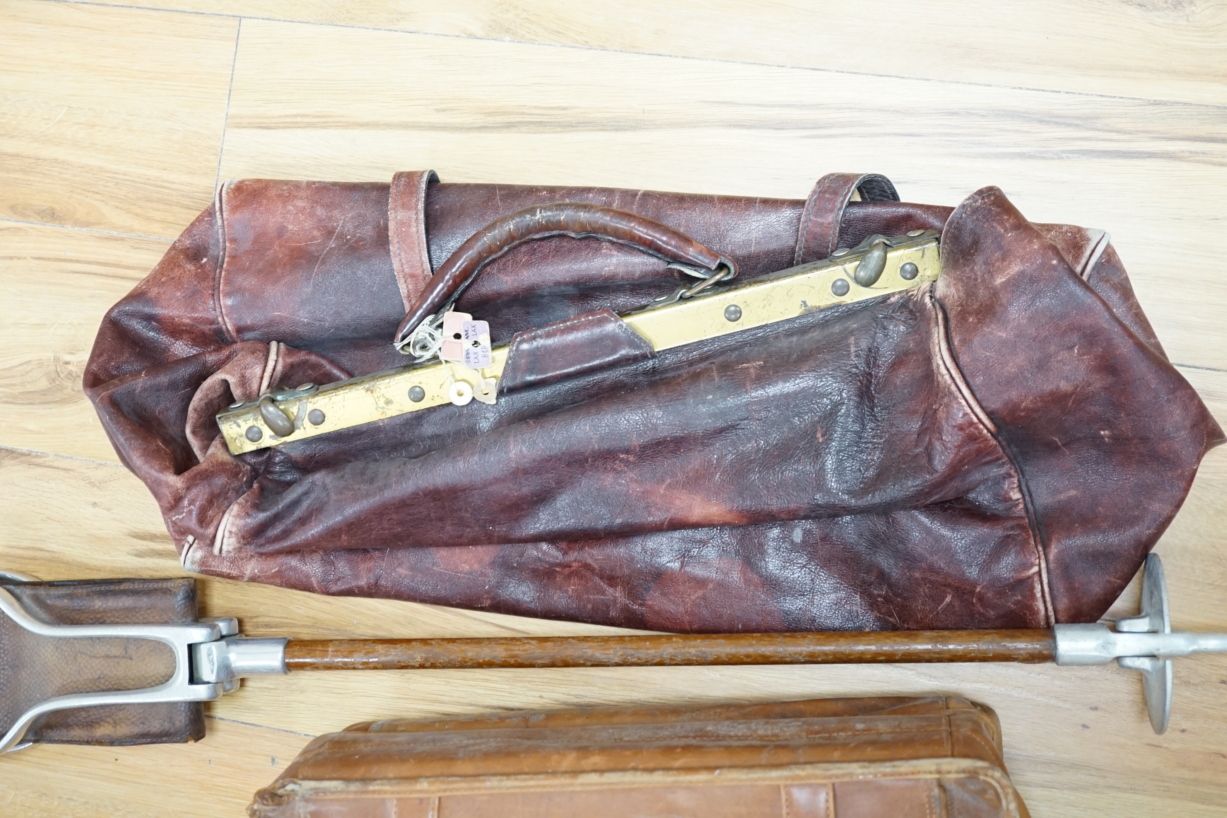 A leather Gladstone bag, an attaché case and a shooting stick